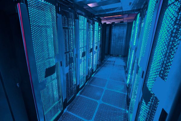 Glowing server racks in a corridor